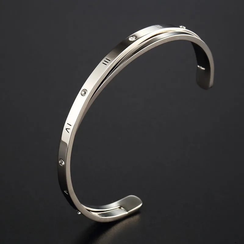 Open-ended stainless steel women's bracelet with inlaid zircon stones and love heart design in electroplated rose gold finish