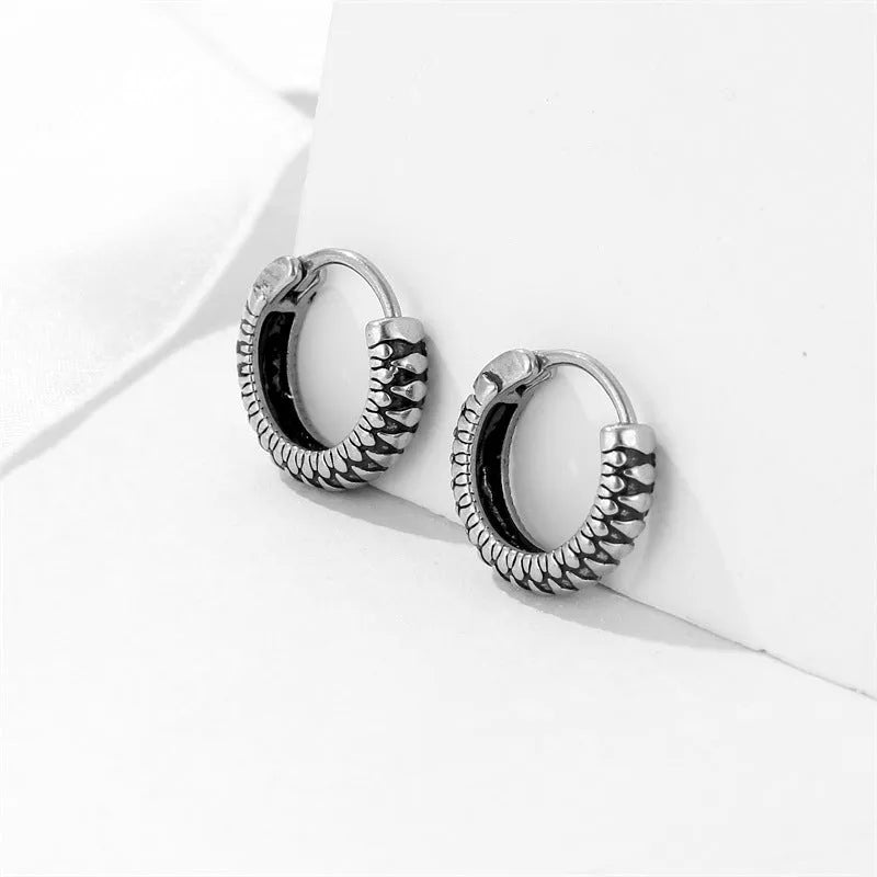 Silver titanium steel retro earrings with a geometric twist and striped design.