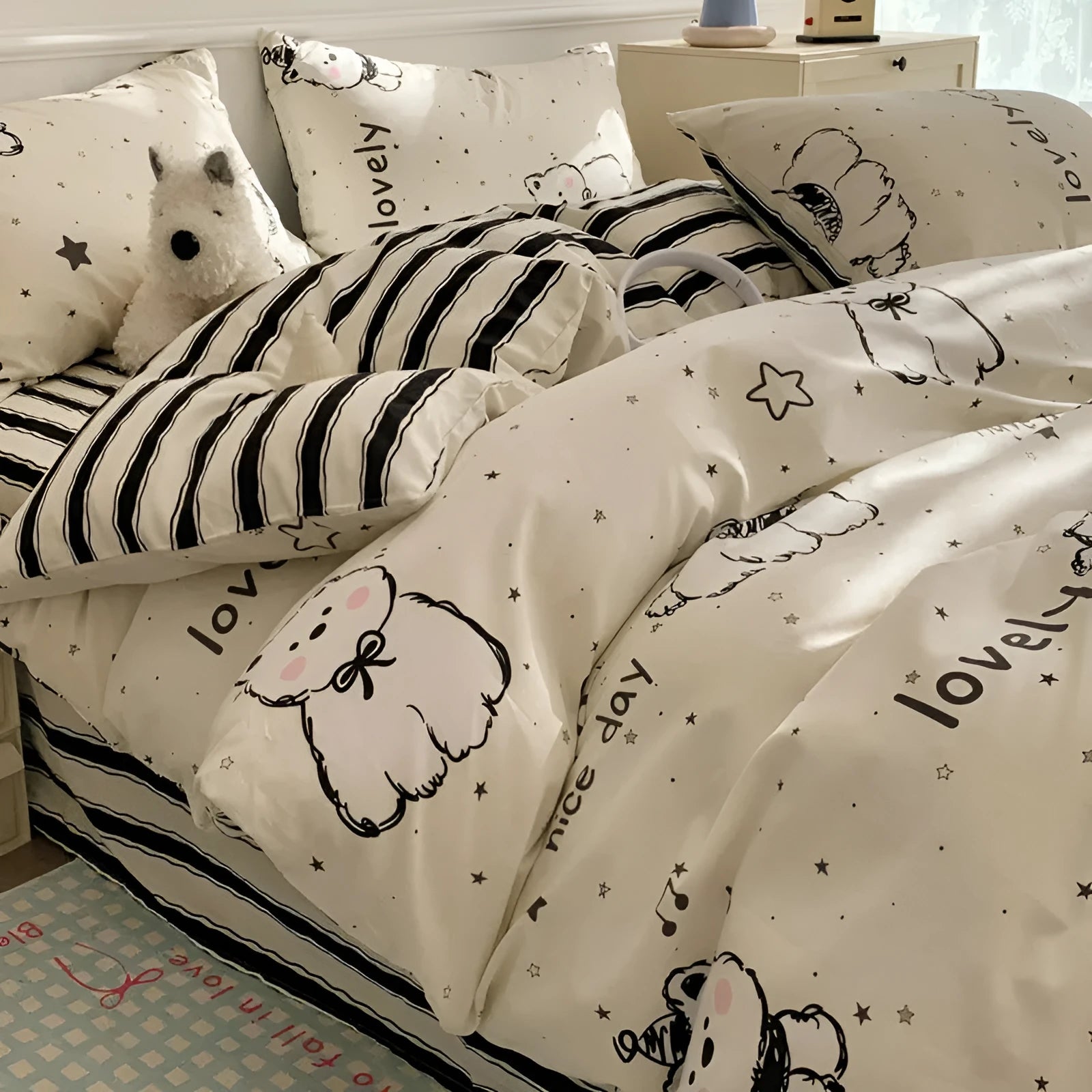 Cartoon dog print pure cotton bedding four-piece set shown on a bed