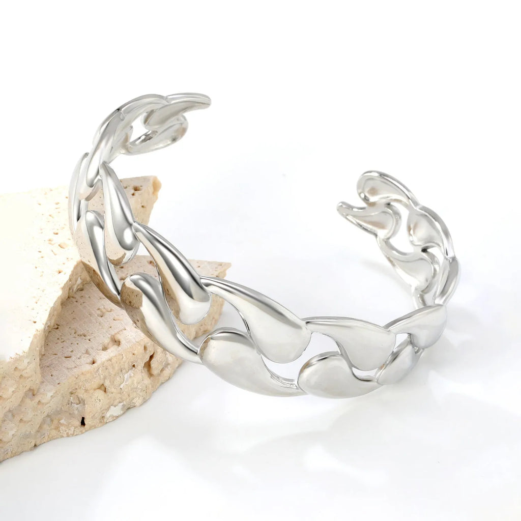 Stainless steel European and American style luxe bracelet on a wrist, showing advanced metallic finish.