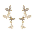 Women's copper butterfly drop earrings with four-butterfly design in gold colour