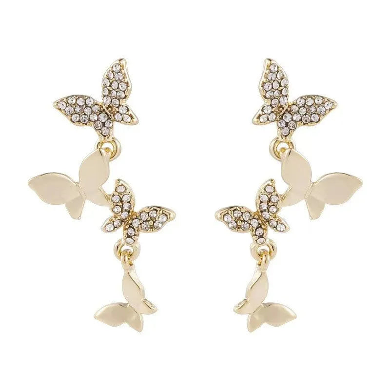Women's copper butterfly drop earrings with four-butterfly design in gold colour