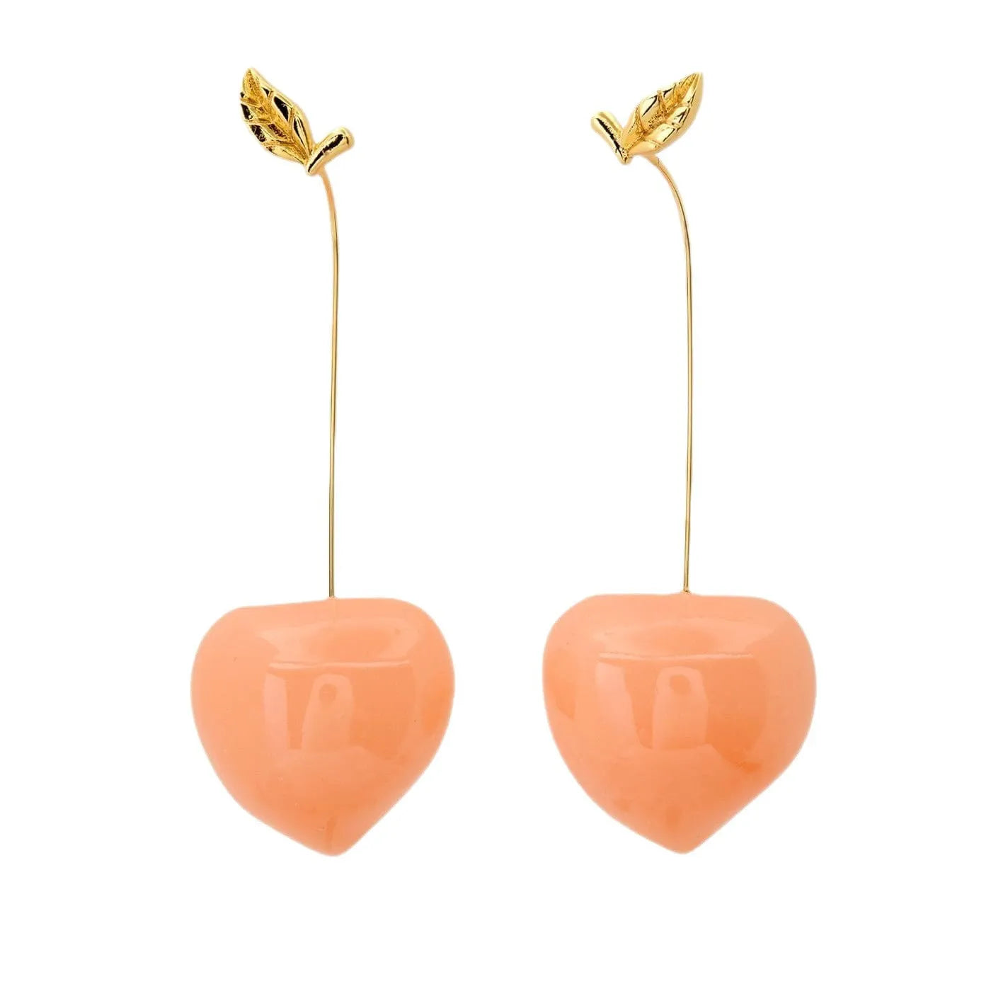 Gold plated copper earrings featuring fruit and vegetable shapes in multiple colours on display