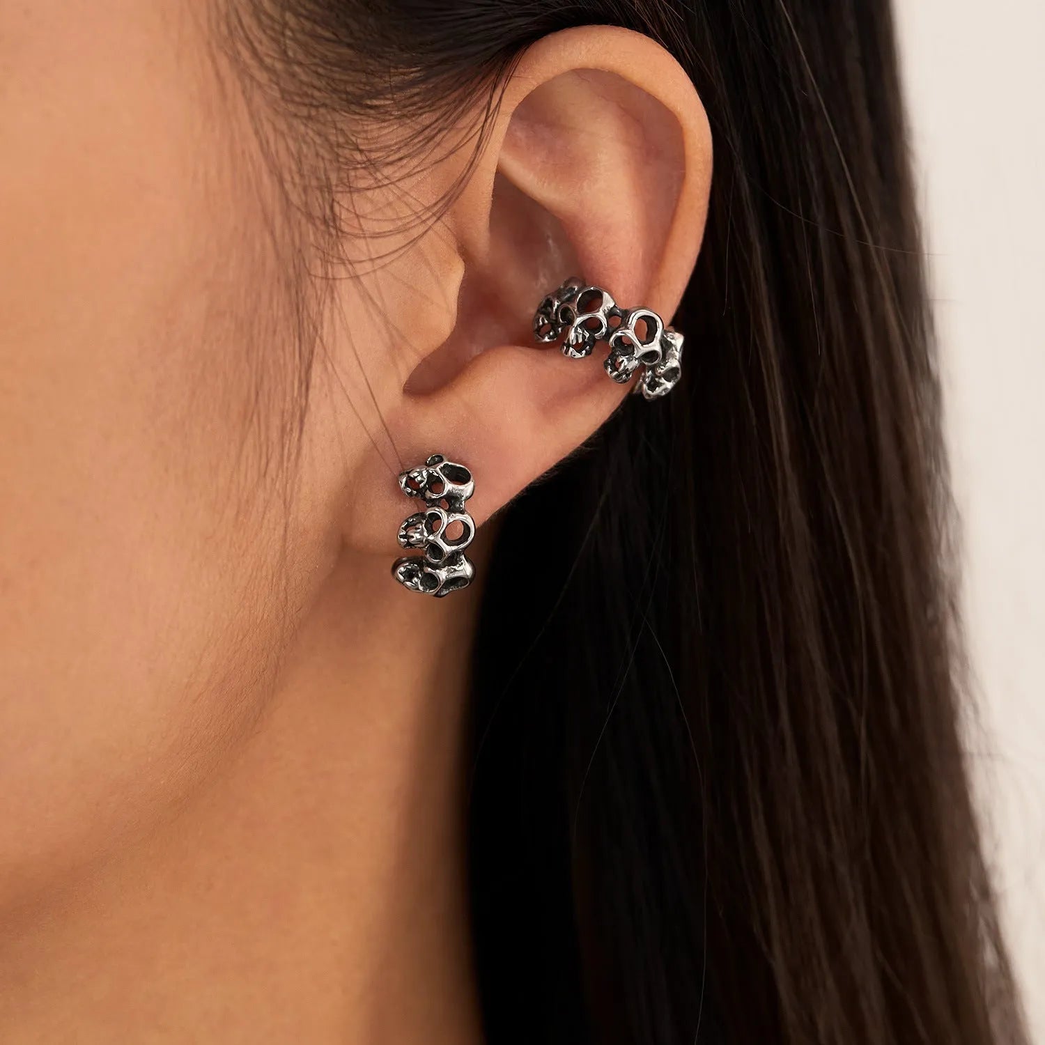 Stainless steel retro skull ear clip earrings with hollow geometric design