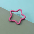 Zinc alloy five-pointed star keychain charm in multiple colour options on a keyring.