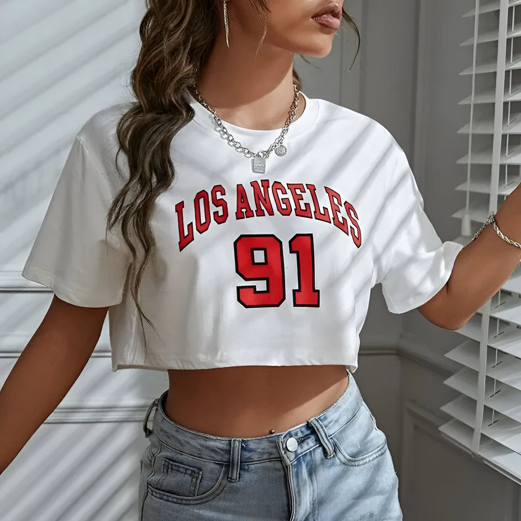 Black cotton loose fit t-shirt with exposed navel design showing printed English letters on front