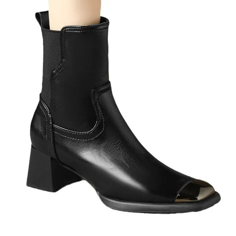 Brown women's cowhide leather Martin boots with a high heel and side zipper on a white background.