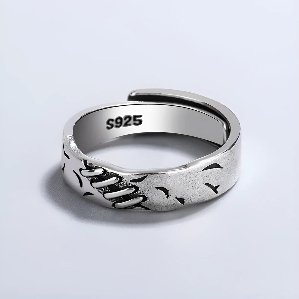 Black copper geometric adjustable ring with round and oval shapes on a white background