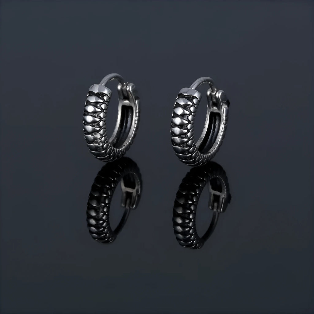 Silver titanium steel retro earrings with a geometric twist and striped design.