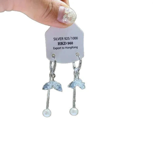 Geometric alloy ear clip with a heart rhinestone and dangling tassel, showing both stud and clip-on back options.