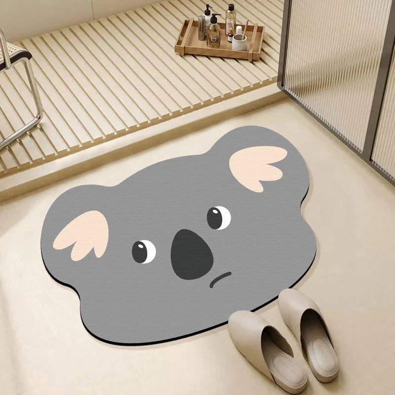 Cartoon animal diatom ooze bathroom mat in sizes 40x60cm, 50x80cm, 60x90cm on a bathroom floor.