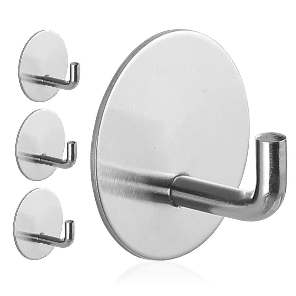 Two round stainless steel self-adhesive hooks, one black and one sanded polished, on a white background.