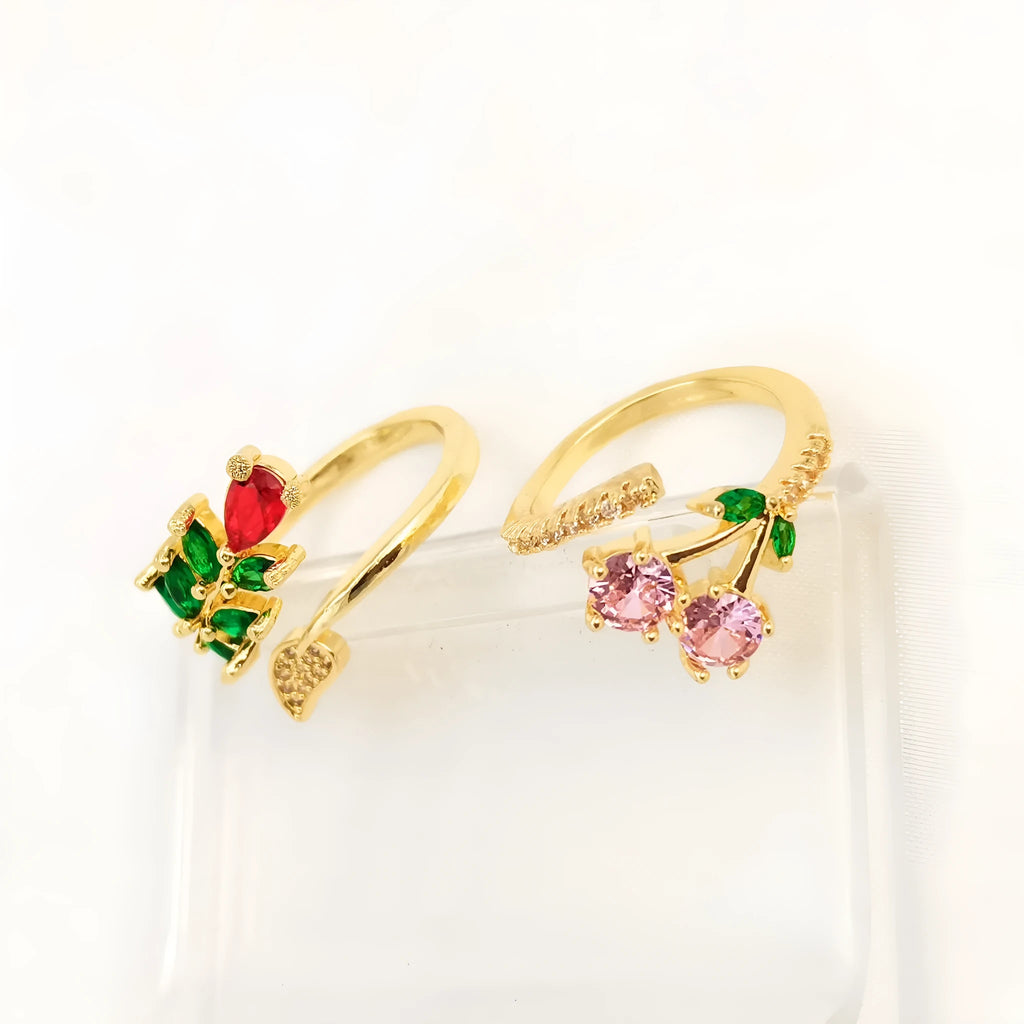 Gold and zircon geometric leaf design on a women's copper open ring.