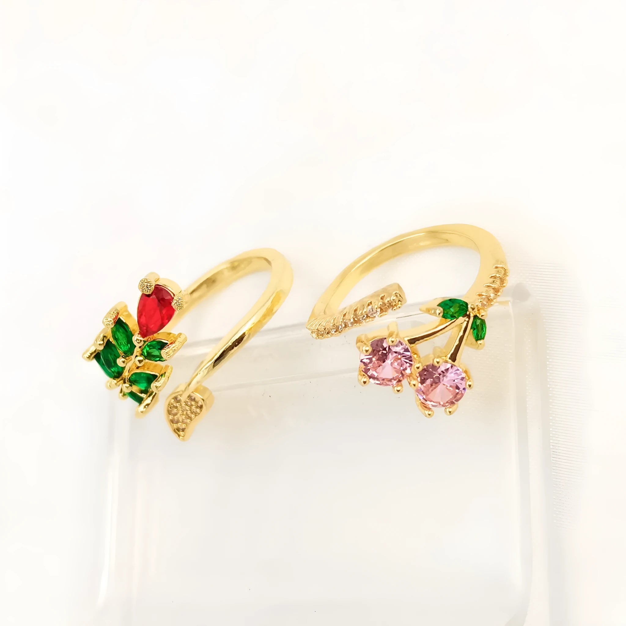 Gold and zircon geometric leaf design on a women's copper open ring.