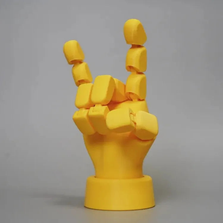 Yellow PLA movable joint hand prop for animation and photography measuring 5x5.38x7.5 cm