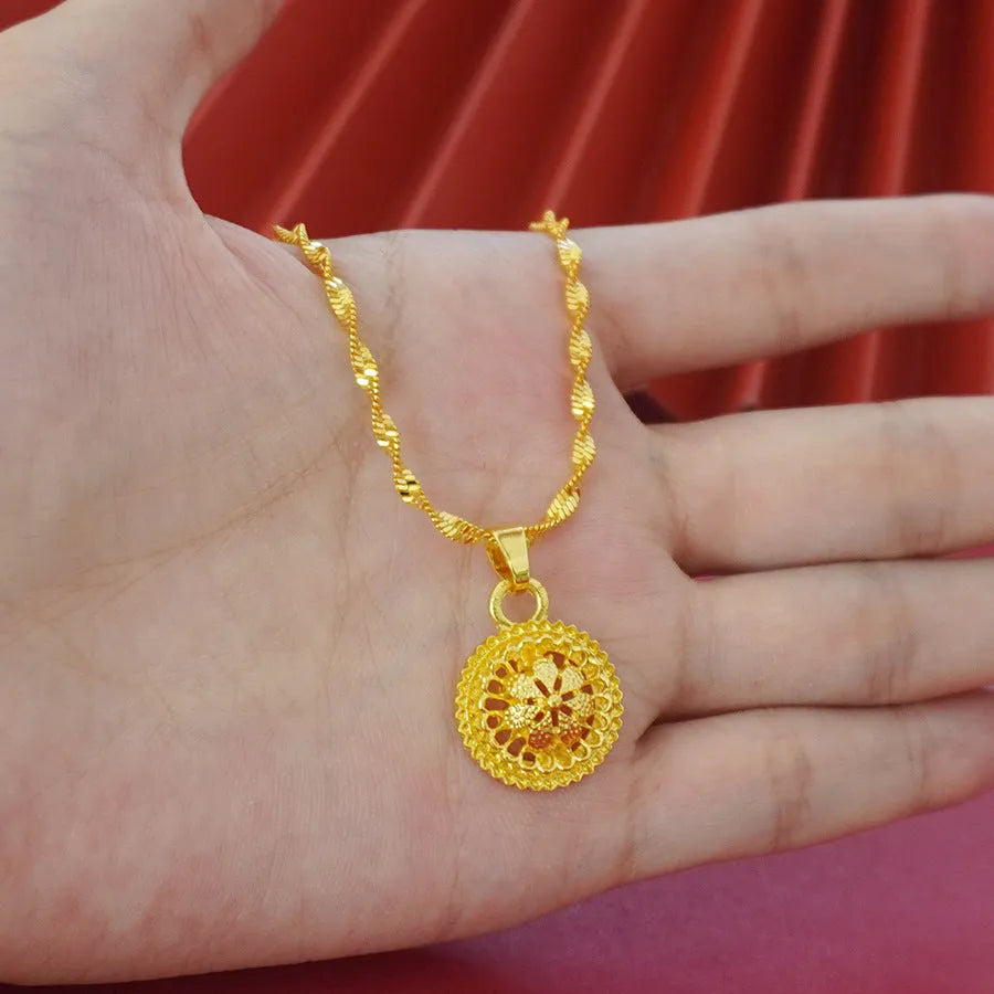 Landscape Middle East gold-plated three-piece jewellery set showing necklace, earrings, and ring with layered floral design.