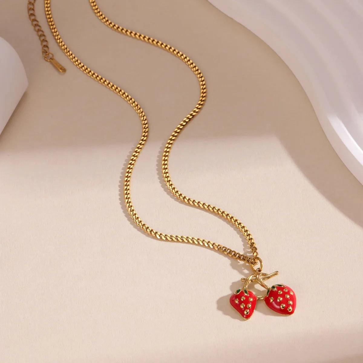 Stainless steel necklace with a strawberry fruit pendant in red or white gradient colour