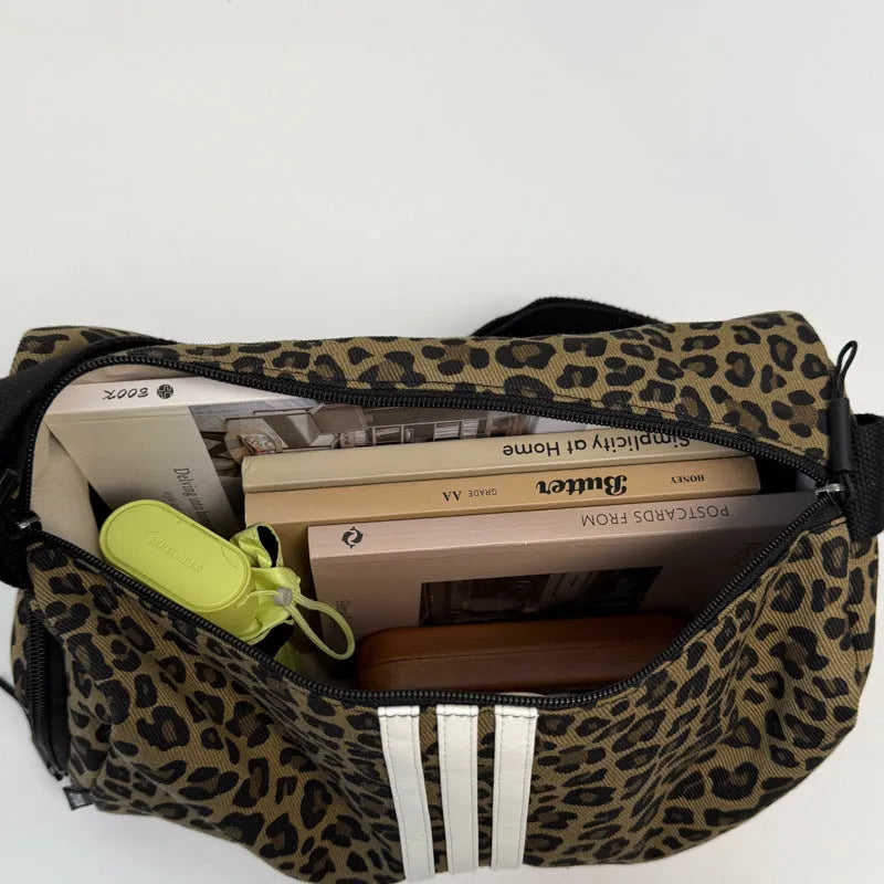 Large capacity leopard print sports style shoulder messenger bag with cloth construction and stitching details