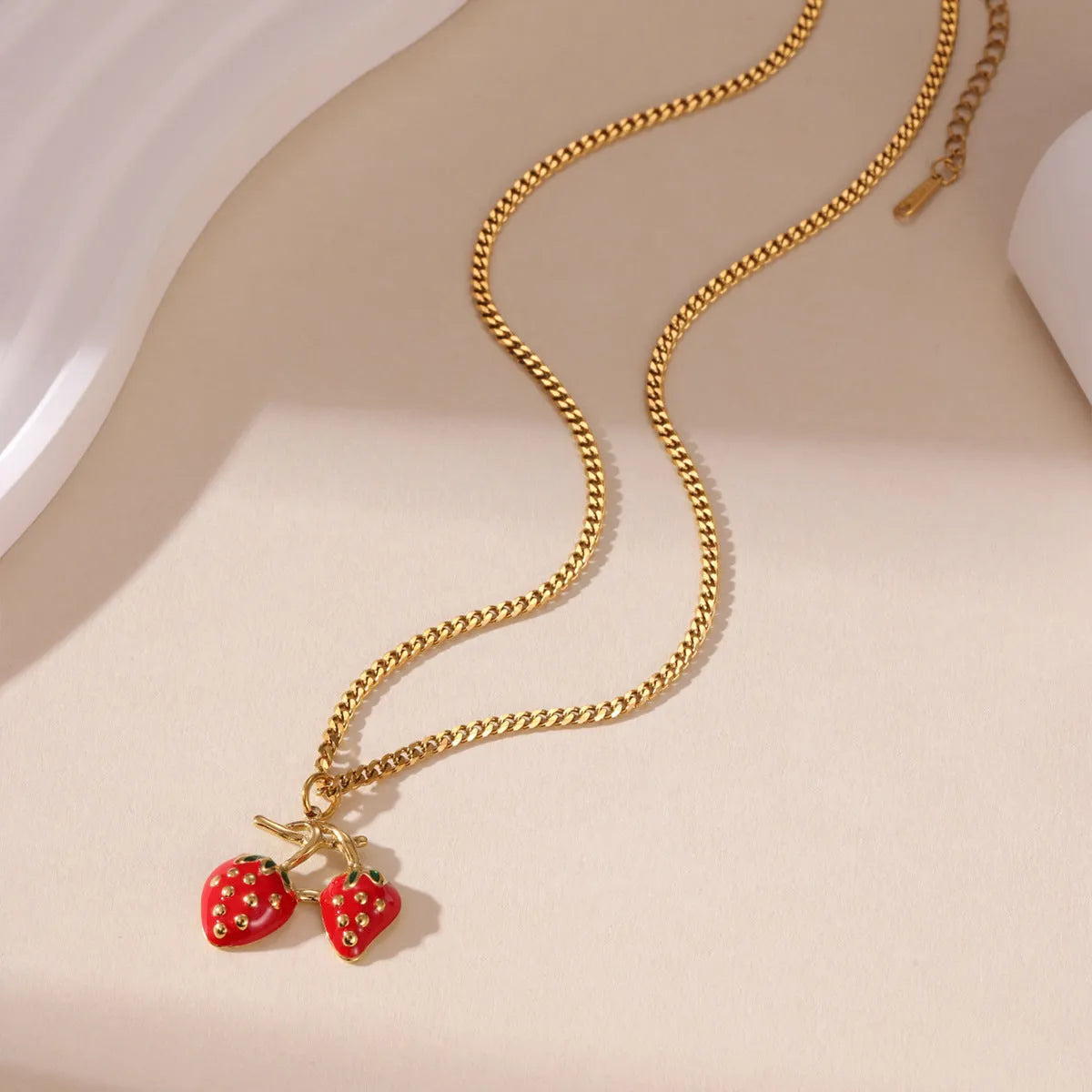 Stainless steel necklace with a strawberry fruit pendant in red or white gradient colour
