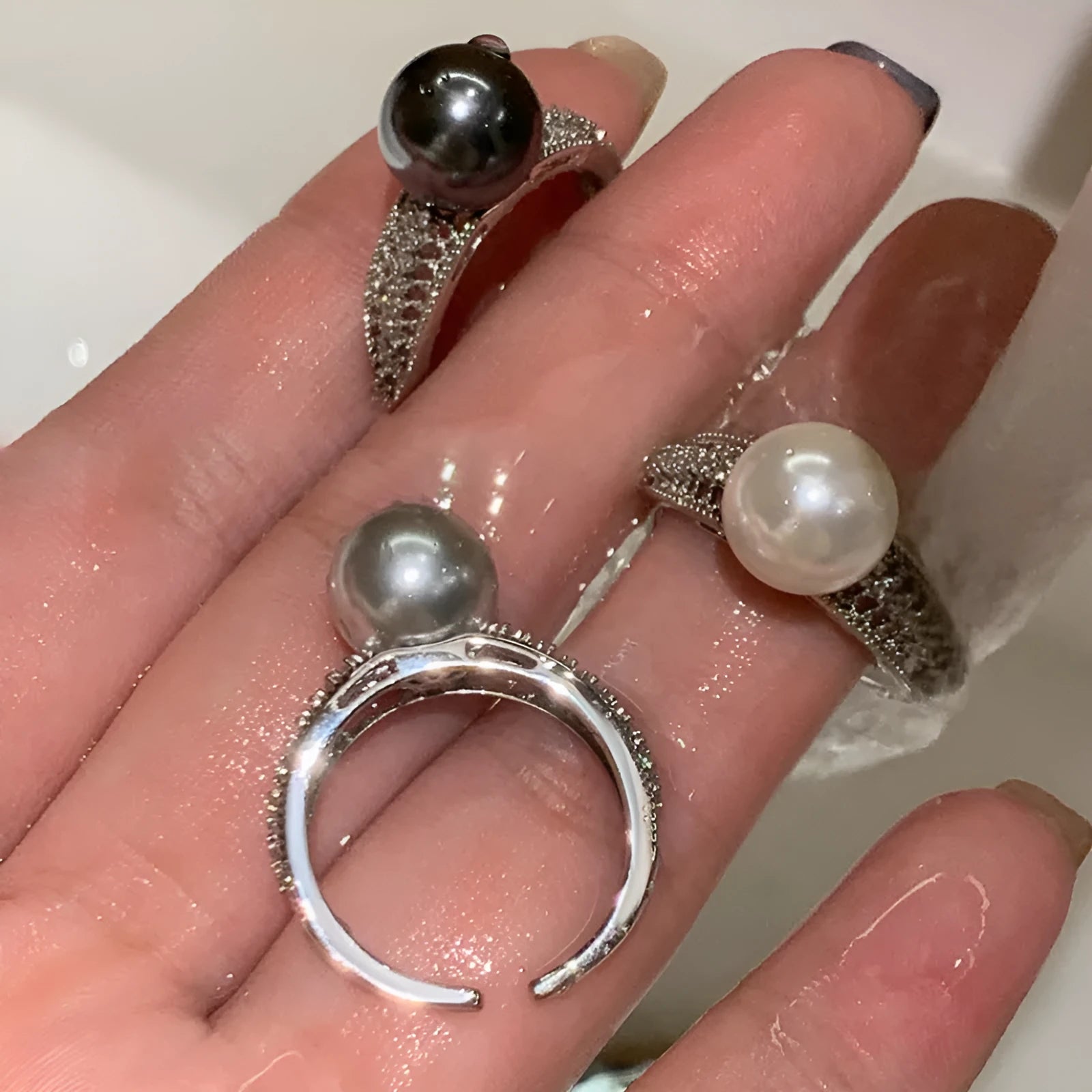 Black pearl geometric open ring with adjustable opening on index finger