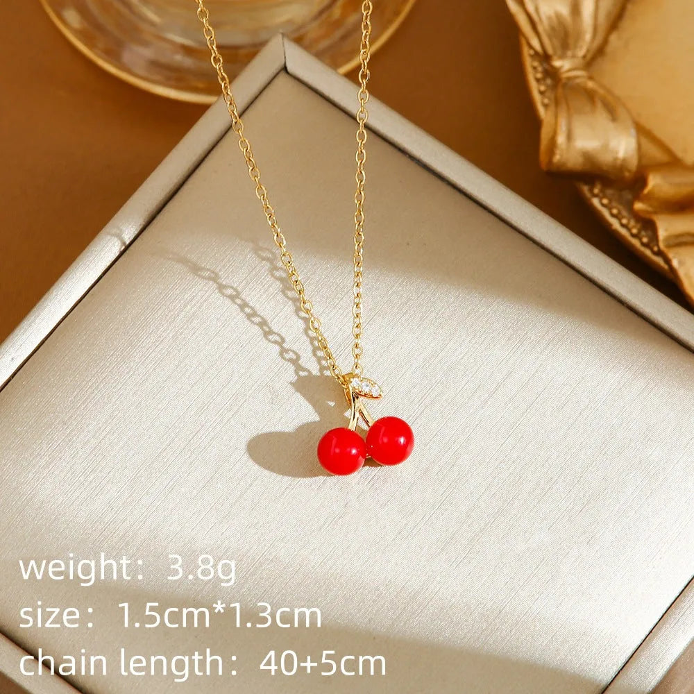 Titanium steel women's necklace with O-ring chain and delicate indie fruit pendant in golden colour options