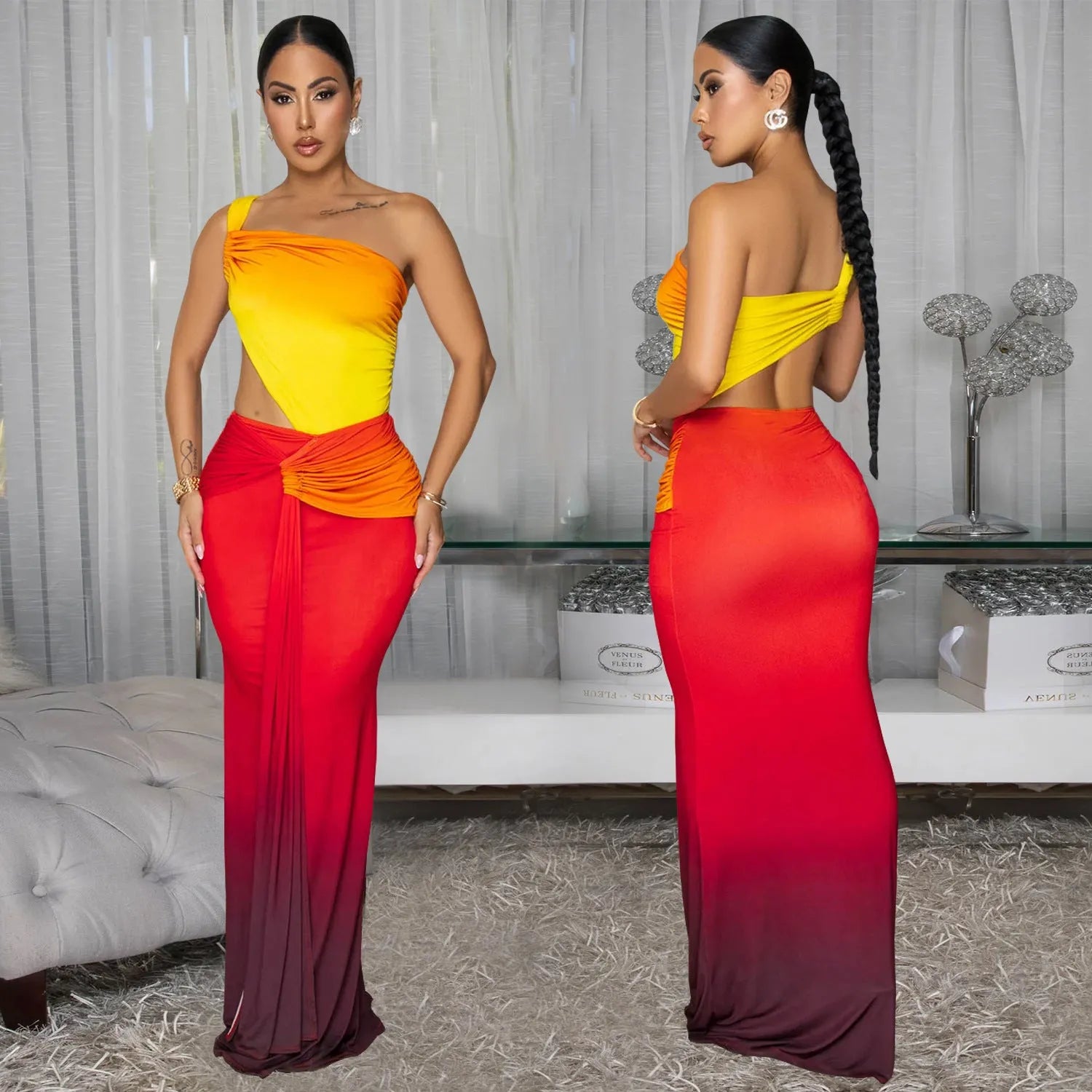 A woman wearing a long gradient colour dress with a cross-shoulder sleeveless design and a high waist.