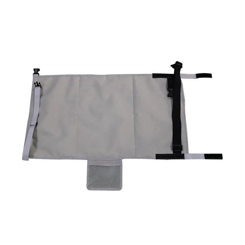Portable grey nylon children's aircraft pedal seat extender with drawstring pocket, shown folded.
