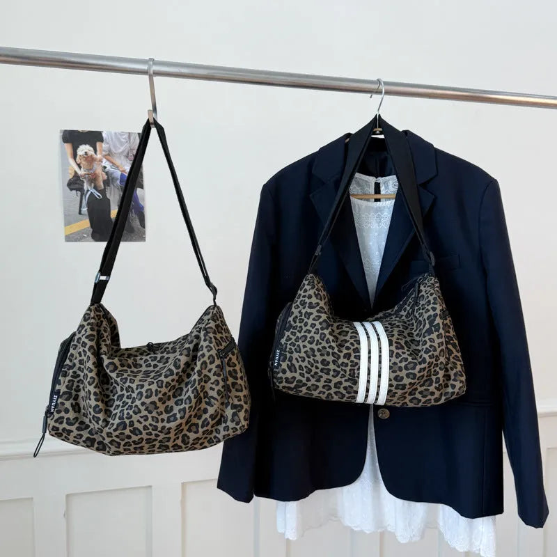 Large capacity leopard print sports style shoulder messenger bag with cloth construction and stitching details