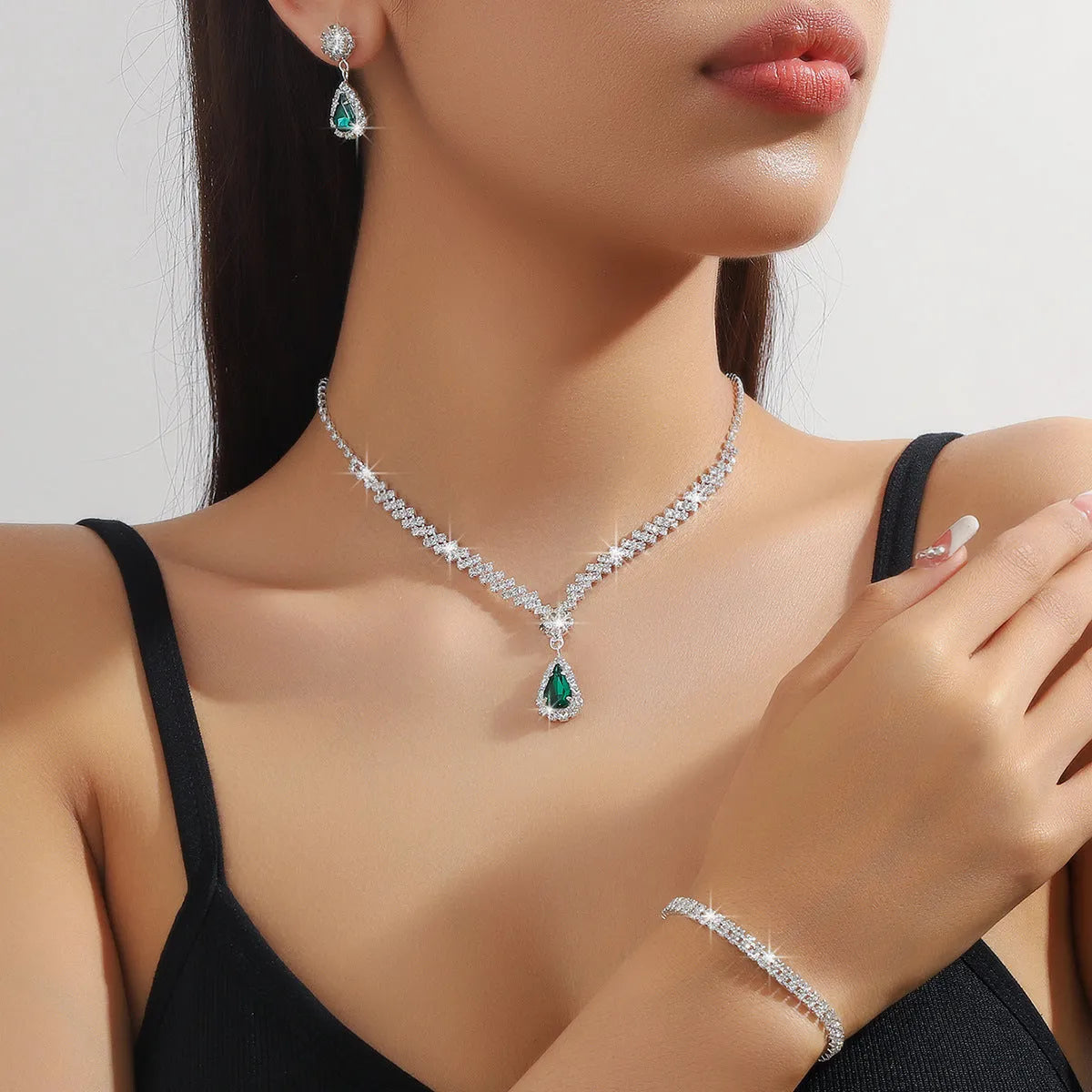 Rhinestone claw chain necklace and earrings set with water drop shape, available in multiple colours for women.