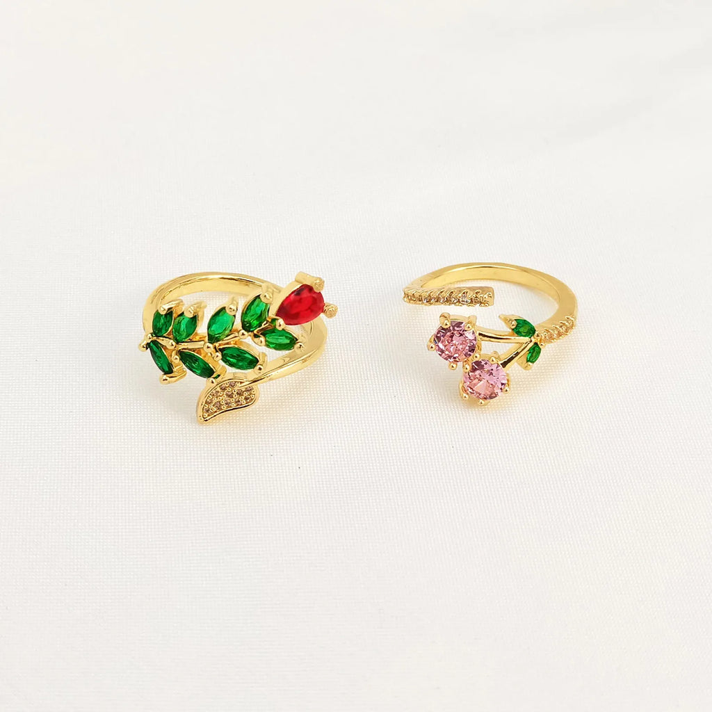 Gold and zircon geometric leaf design on a women's copper open ring.