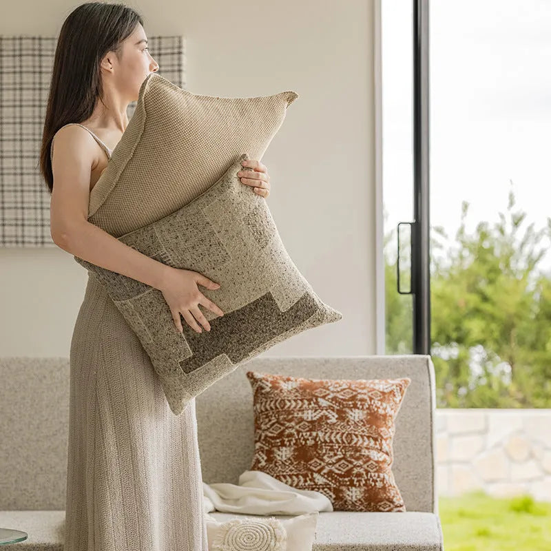 Solid colour sofa cushion pillow on a chair, showing artificial line edge pressing detail.