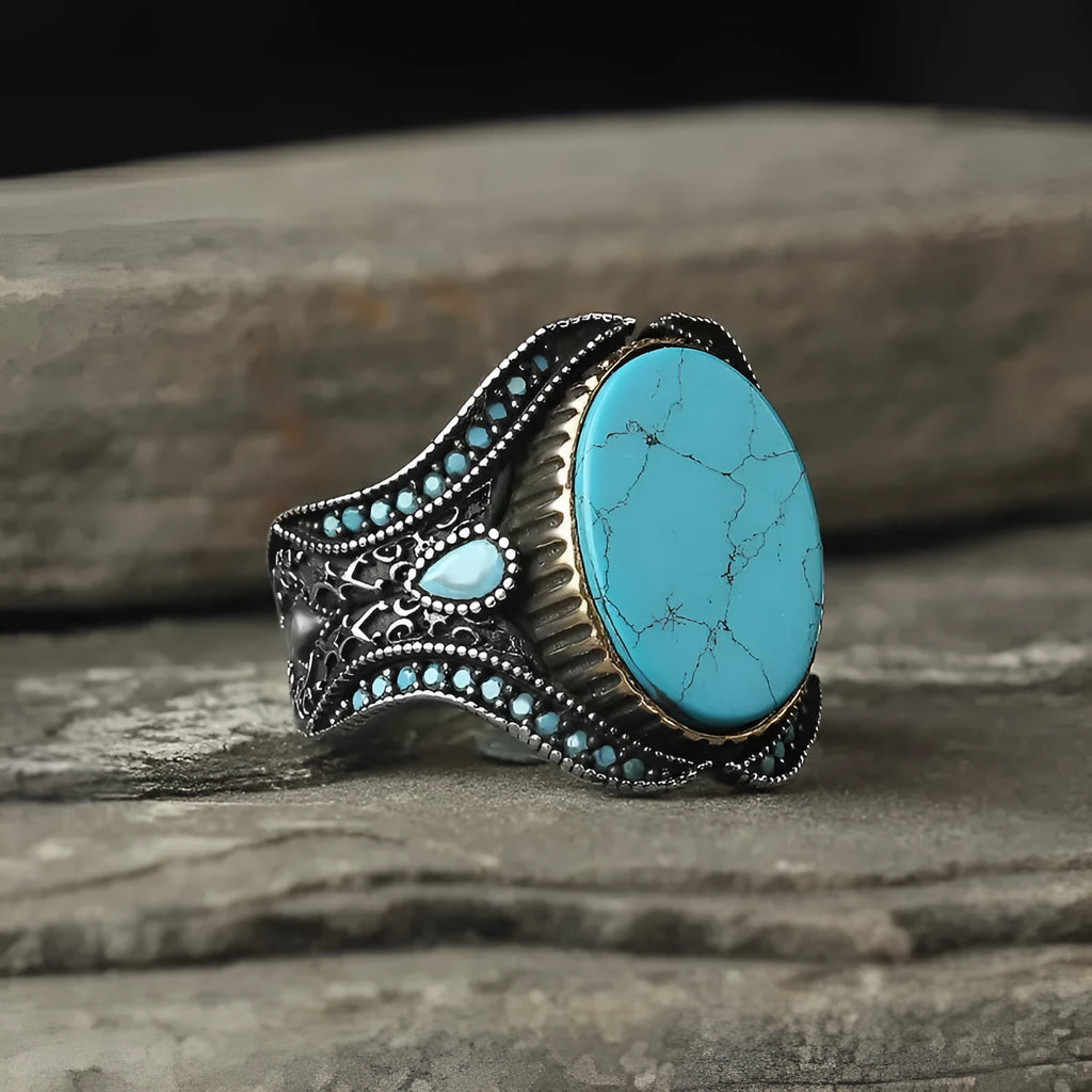 Men's antique silver alloy ring with a round band and a central turquoise-coloured stone.