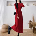 A women's high-waist, mid-length A-line acrylic knit skirt in a solid colour.
