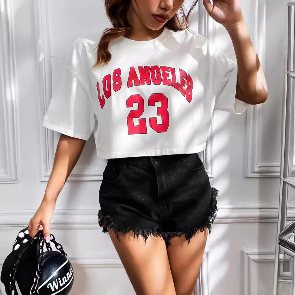 Black cotton loose fit t-shirt with exposed navel design showing printed English letters on front