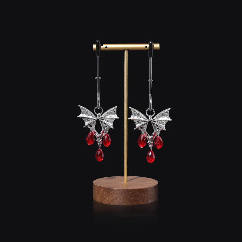Silver alloy Diamond Bat Nipple Clamp with adjustable screw and ruby bat clip on a white background