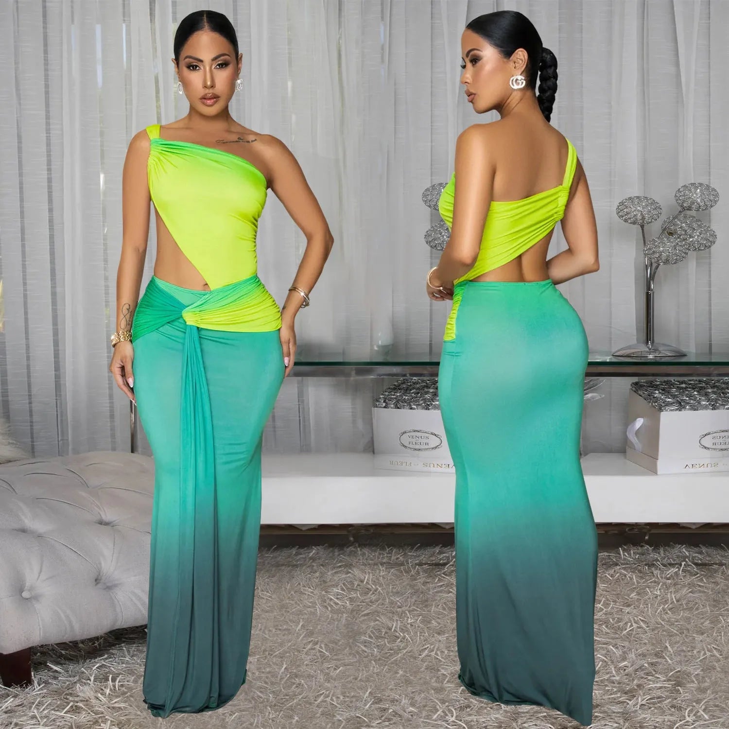 A woman wearing a long gradient colour dress with a cross-shoulder sleeveless design and a high waist.