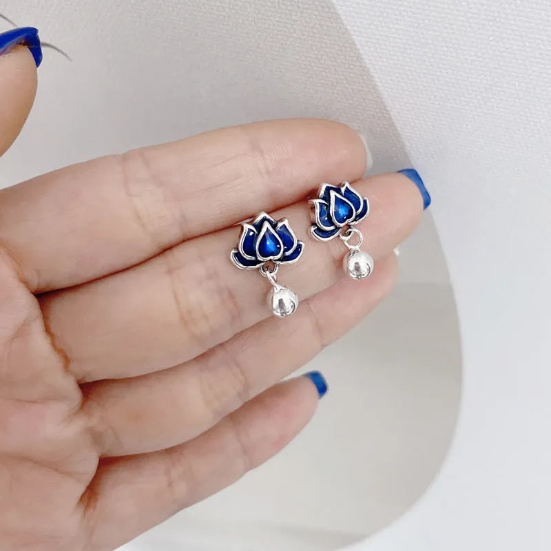 Blue lotus flower alloy earrings with seedpod and tassel design, silver plated, shown at actual size of 1.2cm wide.