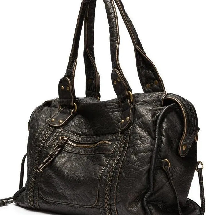 Women's brown retro shoulder messenger bag made of soft PU, showing weaving detail and a single strap.