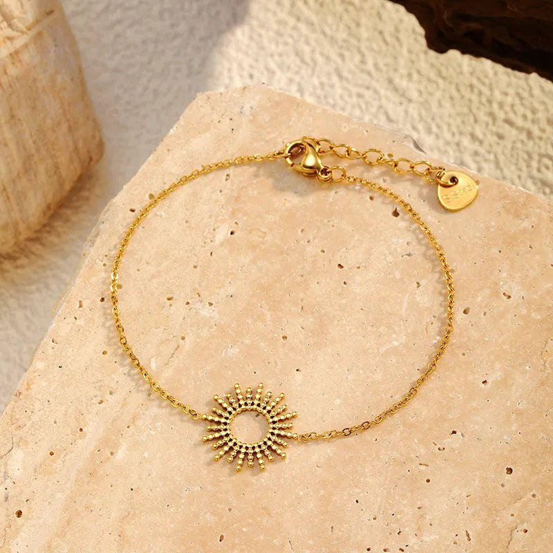 Gold sunflower necklace and bracelet set for women with geometric design