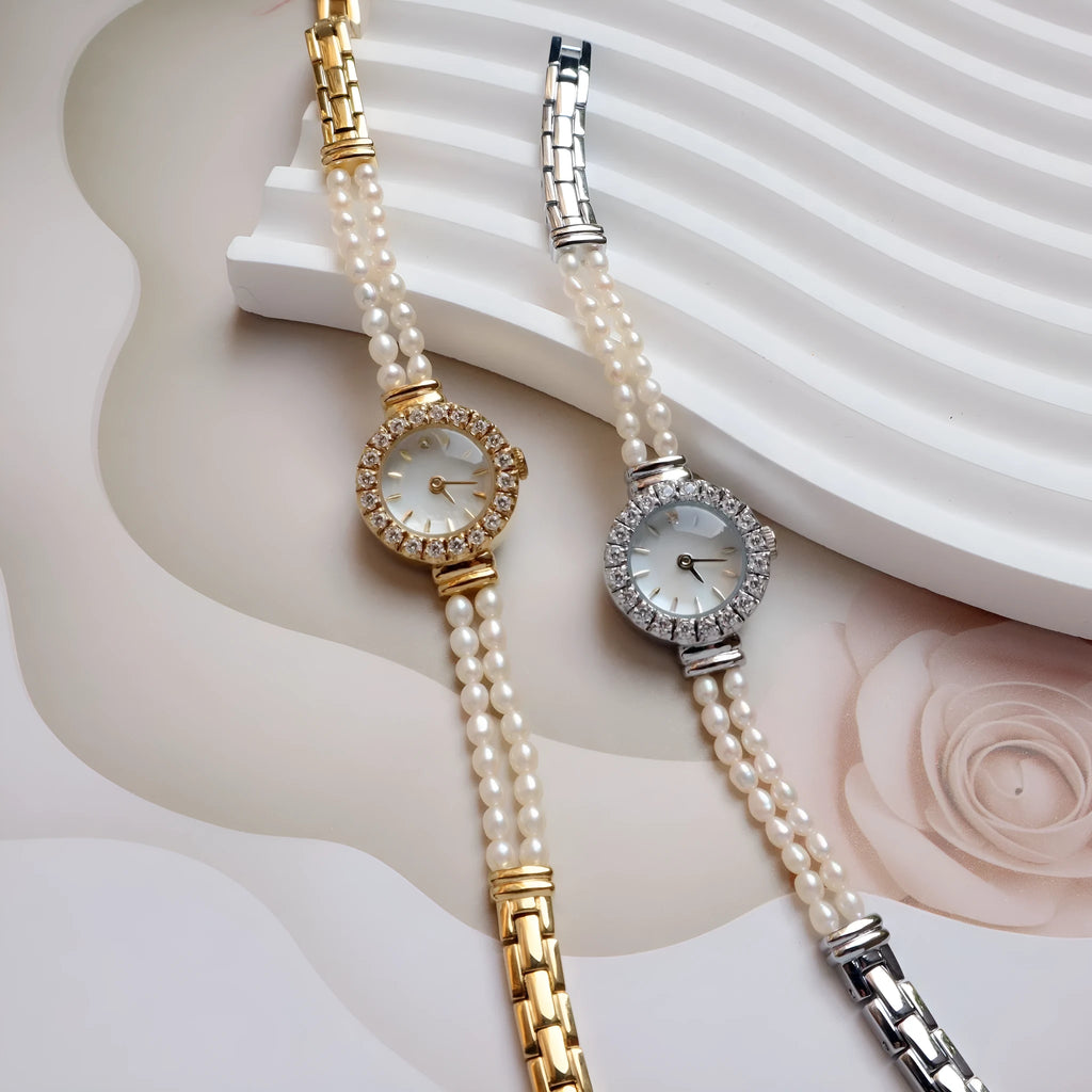 Women's light gold bracelet watch with freshwater pearls, round dial and stainless steel strap
