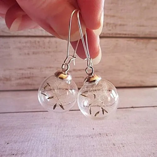 Transparent glass dandelion seed earrings with French hooks in silver and bronze finishes