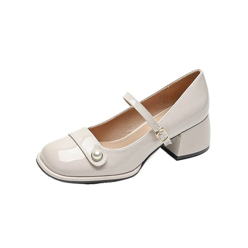 Apricot-coloured plus size hiking boots with a chunky heel, patent leather upper, and buckle fastening.