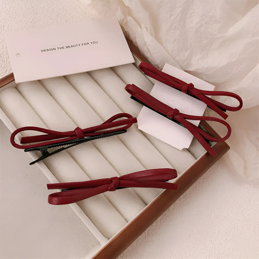 Wine red leather bow barrettes hair clips with structured design