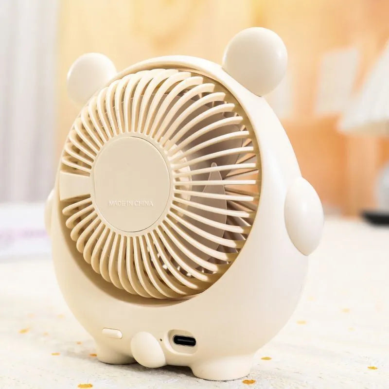 Cute dog-themed USB desktop fan in choice of puppy and bear colours on a desk