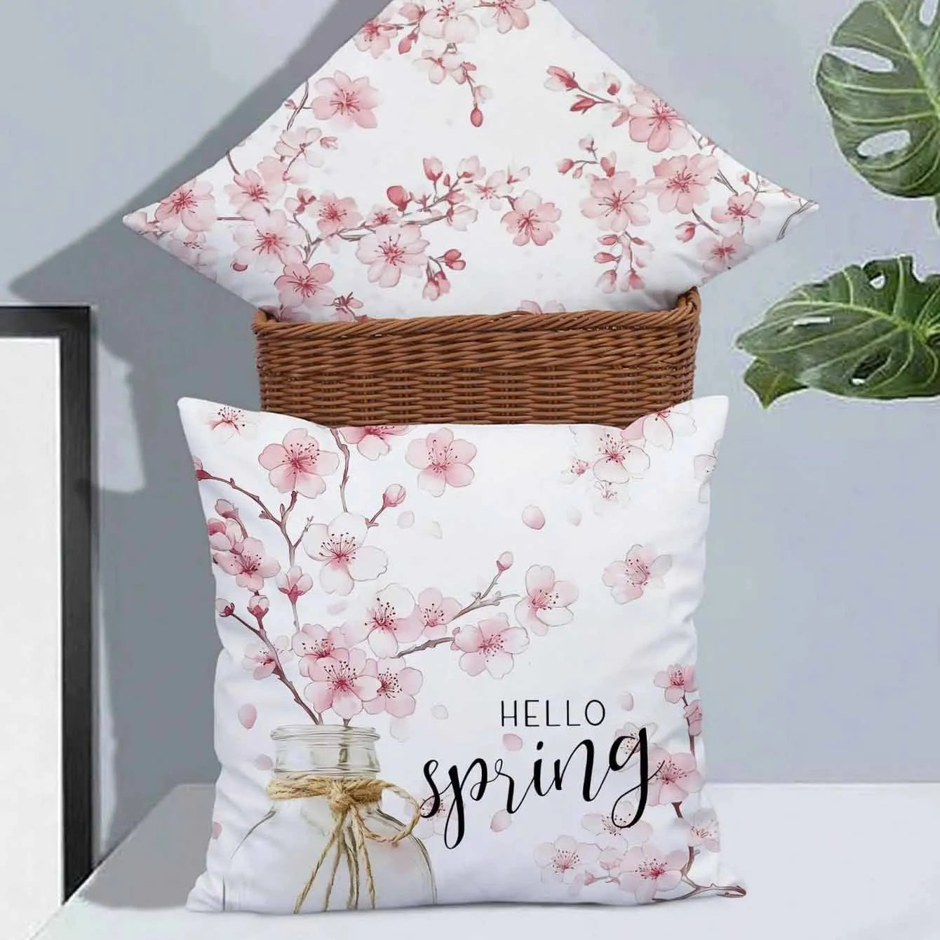 Square short velvet cushion cover with cherry blossom letter print, 45cm size, shown in one of four colour options.