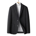 Men's slim fit wool suit jacket in grey, shown on a model, suitable for autumn casual wear.