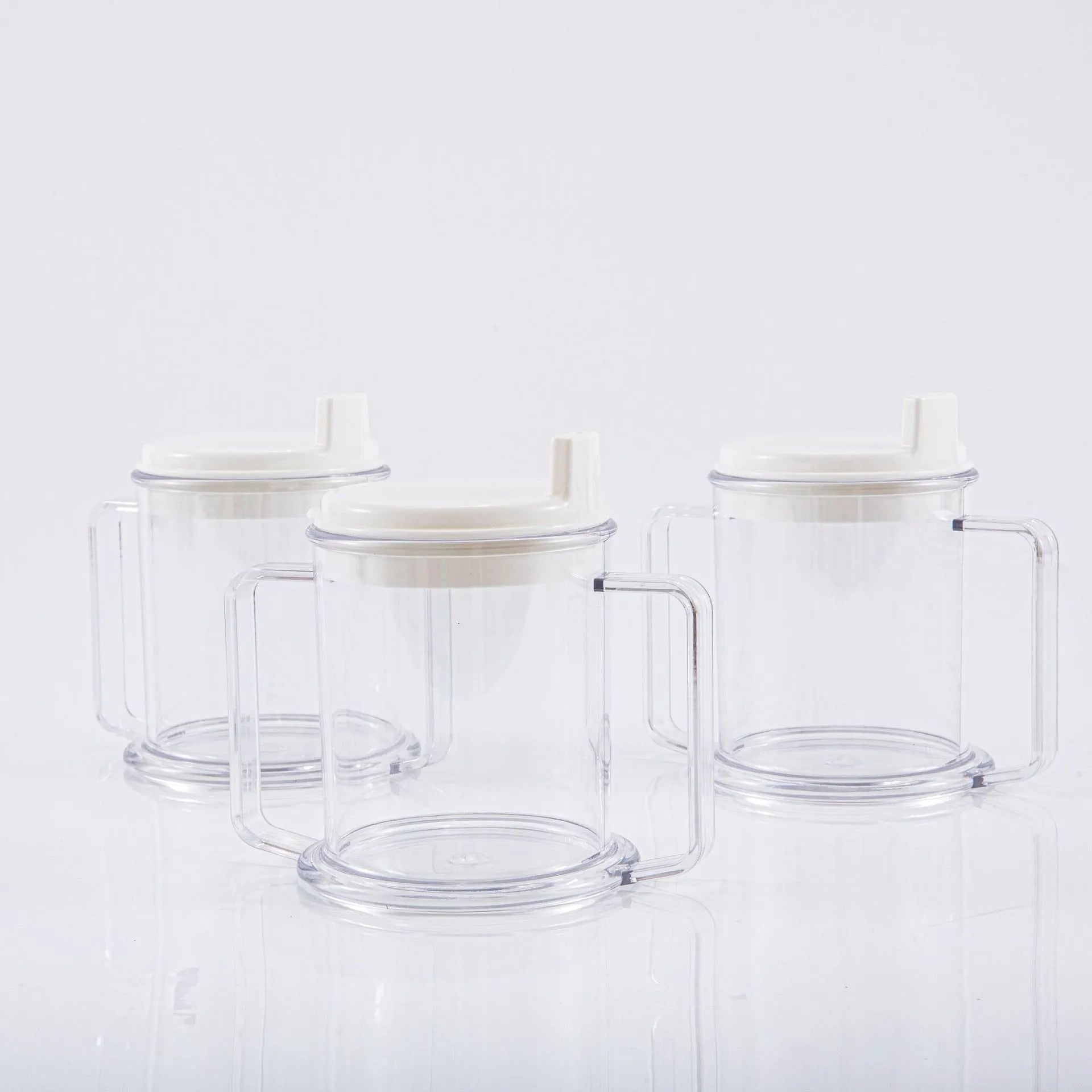 Transparent plastic spill-proof drinking cup showing 14cm height and 12cm brim.