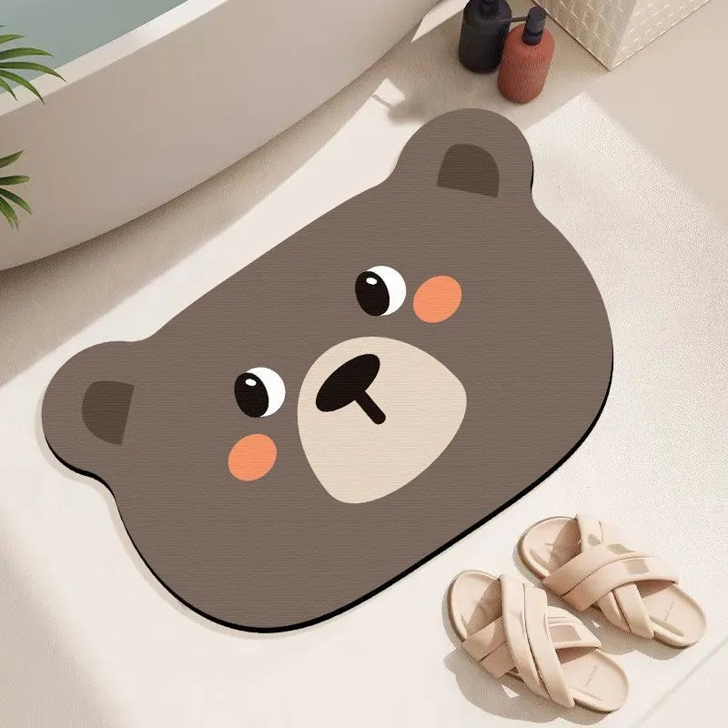 Cartoon animal diatom ooze bathroom mat in sizes 40x60cm, 50x80cm, 60x90cm on a bathroom floor.