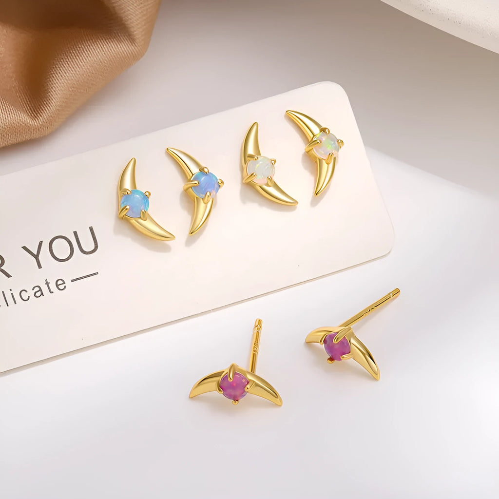 A pair of women's geometric earrings made from 925 silver, shown in gold plating with a blue stone accent.