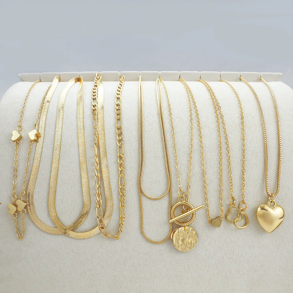 Women's gold necklace set with 10 alloy pendants on adjustable snake bone chain